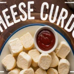 Fresh cheese curds in a bowl, showing their squeaky texture